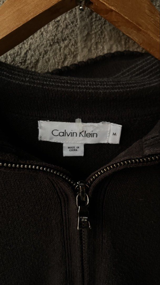 Calvin Klein 100% Cotton Half Zip Sweater Size M (Category: Coats, Jackets and Outerwear) located in Cabuyao City. Submitted by bulandos (Listing ID 1464233137, Image 2). Description: - Classic Calvin Klein sweater - Color: Dark Brown - Size: Medium (M) - Material: 100% Cotton - Features: Half-zip neckline, ribbed cuffs and hem - Versatile: Great for layering or wearing solo - Care: Machine wash cold.