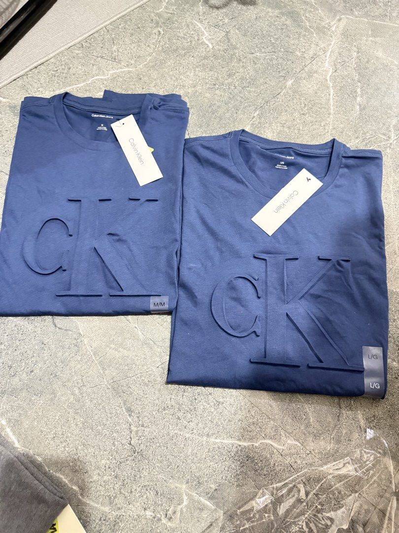 Calvin Klein Embossed Monogram Classic T-Shirt (Category: Tshirts & Polo Shirts ) located in Manila. Submitted by angelsdepot (Listing ID 1464139989, Image 1). Description: Brandnew CK in size Medium and Large 1 each only. Dimensions: M - 21x29 L - 22x29.5.