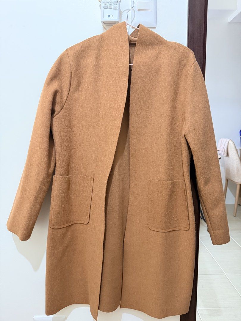 Camel Open Front Longline Coat (Category: Coats, Jackets and Outerwear) located in Mandaluyong City. Submitted by miss_a18 (Listing ID 1464160200, Image 1). Description: - Classic camel coat - Open front design - Two front pockets - Ideal for layering over any outfit - Versatile piece for effortless styling, dress it up or down.