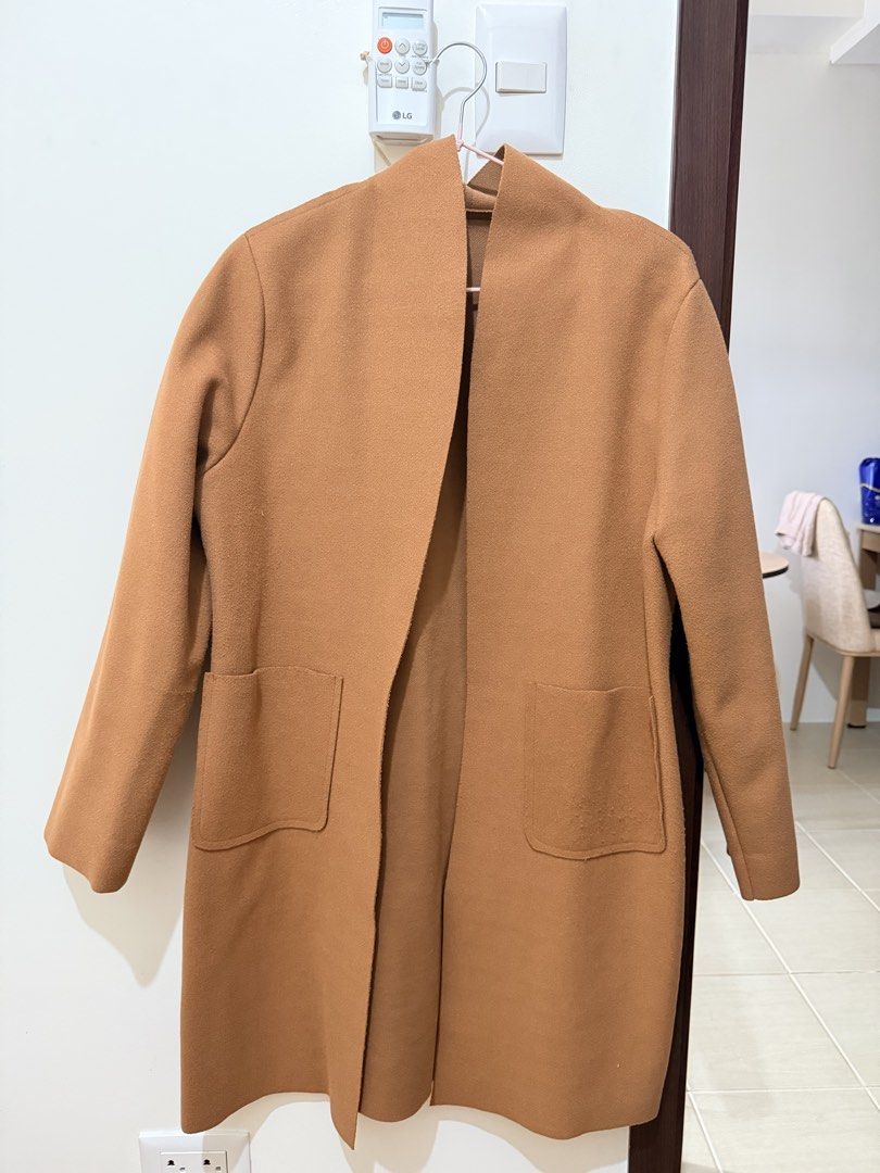Camel Open Front Longline Coat (Category: Coats, Jackets and Outerwear) located in Mandaluyong City. Submitted by miss_a18 (Listing ID 1464160200, Image 2). Description: - Classic camel coat - Open front design - Two front pockets - Ideal for layering over any outfit - Versatile piece for effortless styling, dress it up or down.