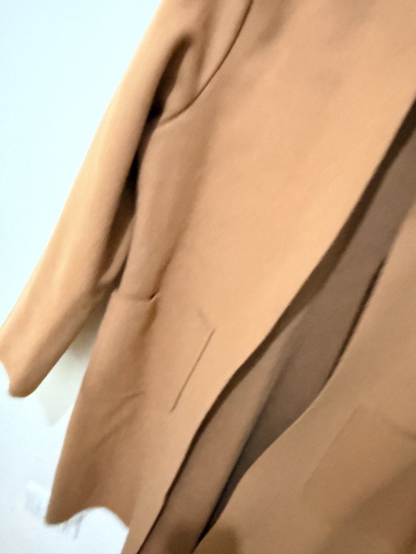 Camel Open Front Longline Coat (Category: Coats, Jackets and Outerwear) located in Mandaluyong City. Submitted by miss_a18 (Listing ID 1464160200, Image 3). Description: - Classic camel coat - Open front design - Two front pockets - Ideal for layering over any outfit - Versatile piece for effortless styling, dress it up or down.