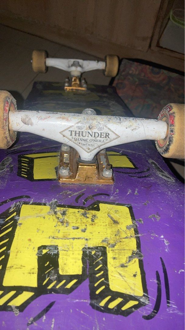 CAPSULE composi-lite Skateboard Deck and Trucks (Category: Skates, Rollerblades & Scooters) located in Manila. Submitted by joaquinalb27209 (Listing ID 1464251783, Image 2). Description: - Purple skateboard deck with yellow graphics - Thunder trucks, Shane O'Neill model - Shows scuffs and wear from use - Virtually unbreakable, resistant to chipping, cracking or delaminating. - Still rides well and is ready for a new owner -Weather proof and water