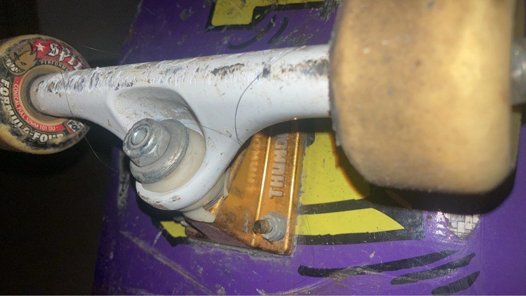 CAPSULE composi-lite Skateboard Deck and Trucks (Category: Skates, Rollerblades & Scooters) located in Manila. Submitted by joaquinalb27209 (Listing ID 1464251783, Image 3). Description: - Purple skateboard deck with yellow graphics - Thunder trucks, Shane O'Neill model - Shows scuffs and wear from use - Virtually unbreakable, resistant to chipping, cracking or delaminating. - Still rides well and is ready for a new owner -Weather proof and water