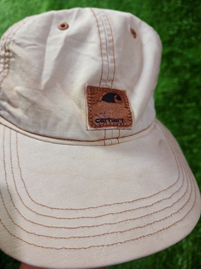Carhartt Beige Cap Hat (Category: Caps & Hats) located in Dipolog. Submitted by vinzz_thrift (Listing ID 1464157791, Image 2). Description: - Classic Carhartt cap - Beige color with contrast stitching - Carhartt logo patch on the front - Adjustable strap for a comfortable fit - Ideal for everyday wear - Simple and durable design.