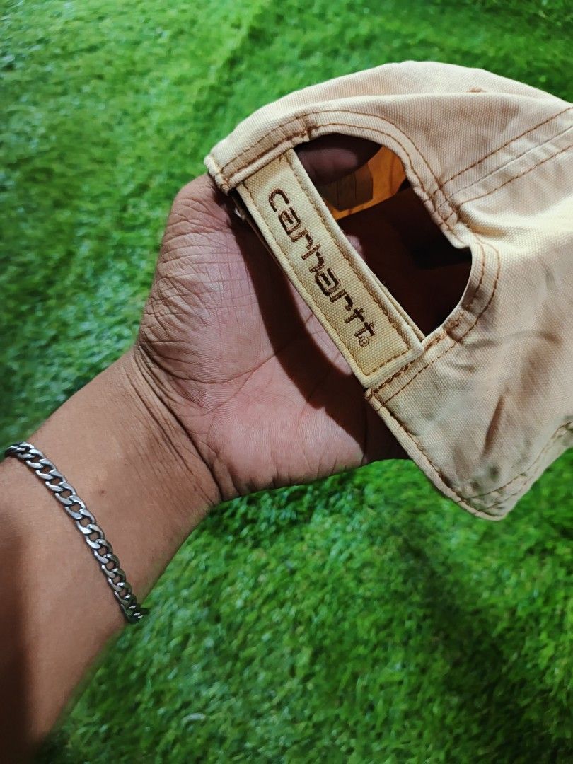 Carhartt Beige Cap Hat (Category: Caps & Hats) located in Dipolog. Submitted by vinzz_thrift (Listing ID 1464157791, Image 3). Description: - Classic Carhartt cap - Beige color with contrast stitching - Carhartt logo patch on the front - Adjustable strap for a comfortable fit - Ideal for everyday wear - Simple and durable design.
