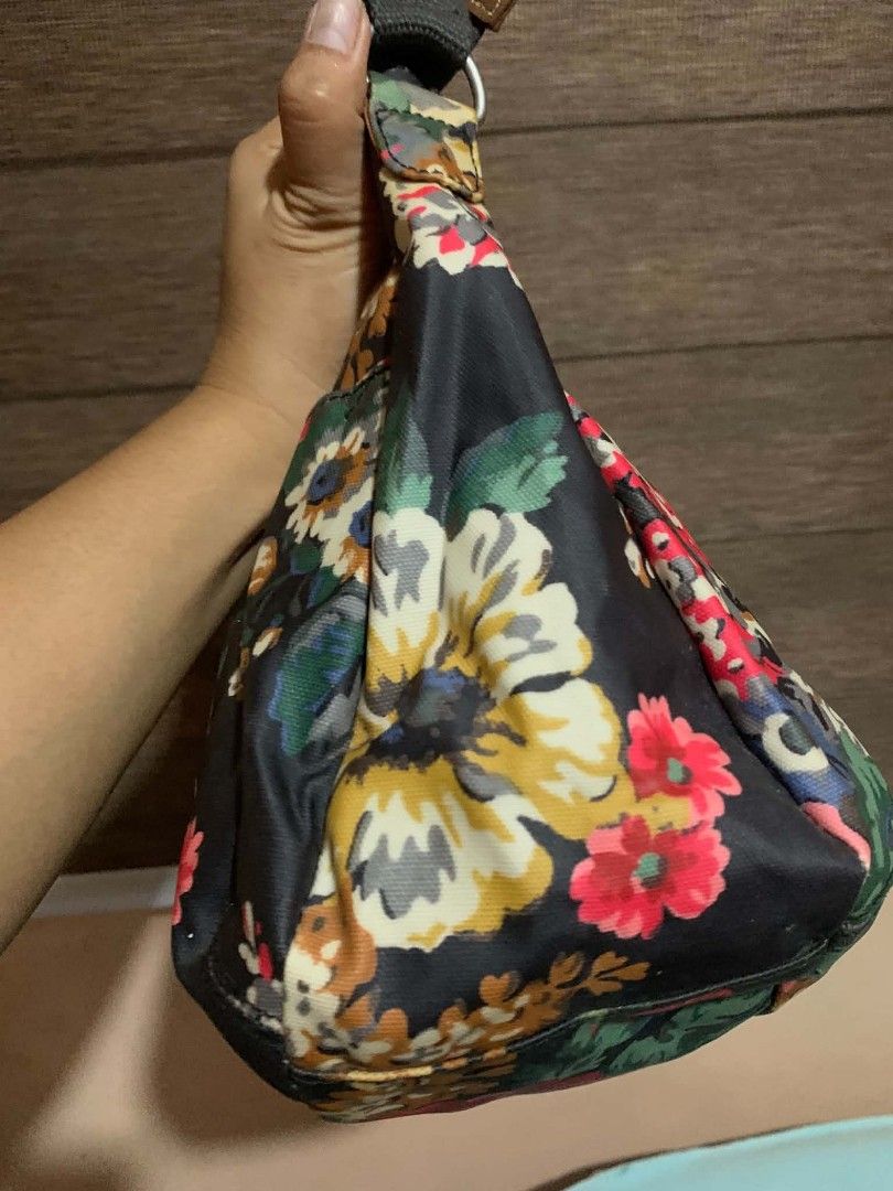 Cath Kidston Floral Shoulder Bag (Category: Shoulder Bags) located in Aliaga. Submitted by akishaoshop2010. (Listing ID 1464139694, Image 2). Description: - Adorable floral print shoulder bag - Black base with vibrant, colorful flowers - Adjustable strap for comfortable wear - Secure zipper closure - Ideal for everyday use - Spacious interior for your essentials.