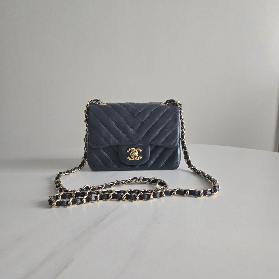 Cc Mini Flap (Category: Luxury Bags & Wallets) located in Paranaque City. Submitted by dclutterqueen (Listing ID 1464162044, Image 1). Description: Chanel Square Mini Flap in Navy Blue color 💯 Genuine Leather - Lambskin in Chevron quilted pattern 🇯🇵 Acquired preloved from Japan 👜 Measures approximately 6.5 x 5 inches.