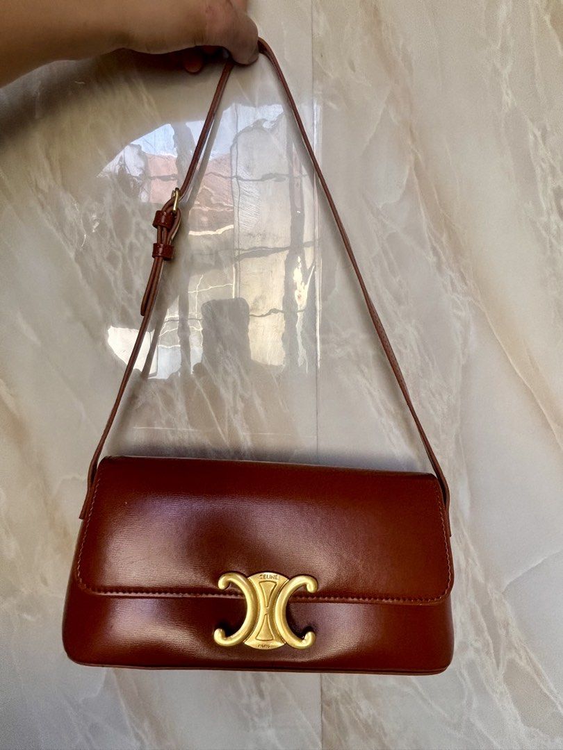 Celine Triomphe Shoulder Bag in Brown Leather (Category: Luxury Bags & Wallets) located in Caloocan City. Submitted by lovelj_2026 (Listing ID 1464251096, Image 3). Description: Japan preloved bags Still in good condition Minimal sign of usage Please manage your expectations. - brown leather Celine shoulder bag - Iconic gold-tone Triomphe clasp - Interior slip pocket for essentials - Adjustable strap for comfortable wear - Timeless and versatile 