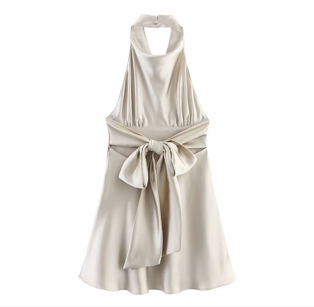 Champagne Satin Halter Dress (Category: Dresses) located in Valenzuela. Submitted by _ellexx (Listing ID 1464198392, Image 3). Description: Brand new, never worn. Elegant champagne satin halter dress. Features V-neck front, tie-back bow detail, and flowy hem. Size: Small Waist: 68cm Length: 79cm Color: Champagne Material: Polyester Length: Above knee Care: Machine washable Suitable for all seasons Simple and classy — just haven’t had the chance t