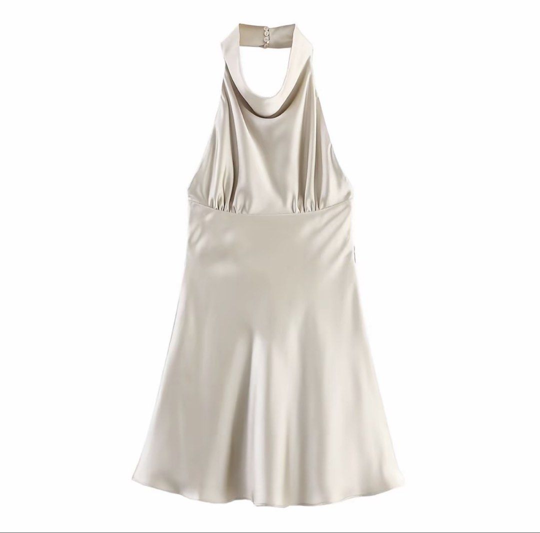 Champagne Satin Halter Dress (Category: Dresses) located in Valenzuela. Submitted by _ellexx (Listing ID 1464198392, Image 2). Description: Brand new, never worn. Elegant champagne satin halter dress. Features V-neck front, tie-back bow detail, and flowy hem. Size: Small Waist: 68cm Length: 79cm Color: Champagne Material: Polyester Length: Above knee Care: Machine washable Suitable for all seasons Simple and classy — just haven’t had the chance t