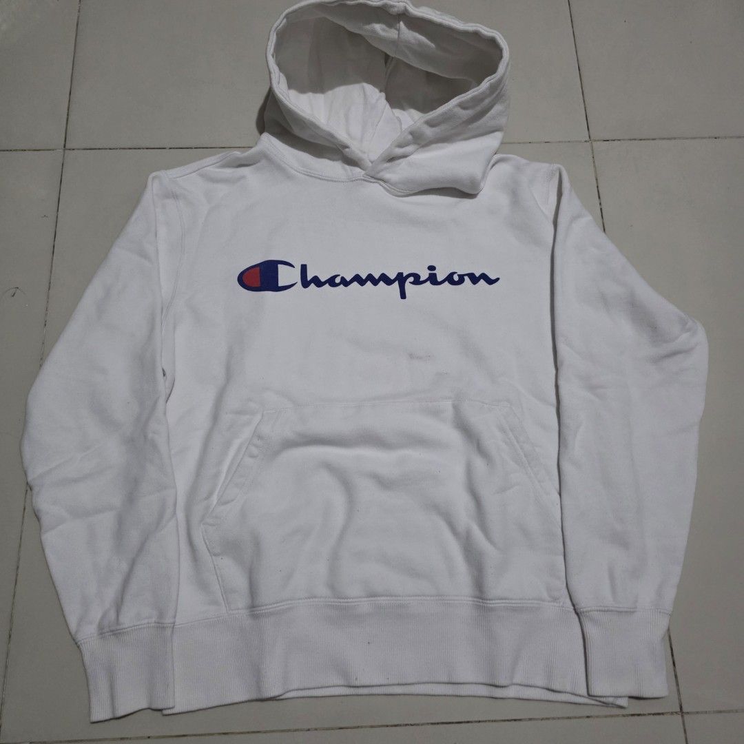 Champion White Hoodie with Vertical Logo (Category: Hoodies) located in Quezon City. Submitted by kick_mnl (Listing ID 1464164670, Image 1). Description: - Classic white Champion hoodie - Features iconic vertical Champion logo in blue and red - Convenient front pocket - Approximate measurements: 20" chest, 21" length - Ideal for everyday casual wear.