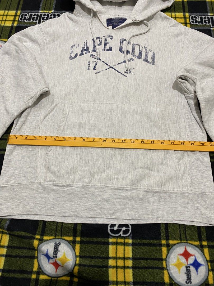 CHAMPION,Pullover hoodie (Category: Coats, Jackets and Outerwear) located in Cavite. Submitted by jc_thrift95 (Listing ID 1464199320, Image 3). Description: - light gray Champion Reverse Weave hoodie features a distressed “Cape Cod” graphic with crossed oars and the numbers 17 and 12 on the front. - Made in Pakistan - Color rate 8/10 - See pictures details for dimes..