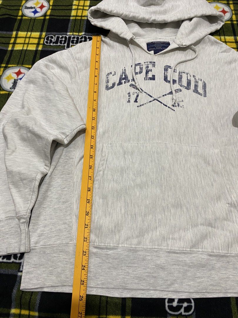 CHAMPION,Pullover hoodie (Category: Coats, Jackets and Outerwear) located in Cavite. Submitted by jc_thrift95 (Listing ID 1464199320, Image 2). Description: - light gray Champion Reverse Weave hoodie features a distressed “Cape Cod” graphic with crossed oars and the numbers 17 and 12 on the front. - Made in Pakistan - Color rate 8/10 - See pictures details for dimes..