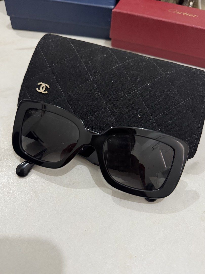 Chanel Black Polarized Sunglasses with CC Logo (Category: Sunglasses & Eyewear) located in Caloocan City. Submitted by fastfire-6117 (Listing ID 1464243984, Image 3). Description: - Authentic Chanel sunglasses - Classic black frame - Gradient polarized lenses for comfort - Iconic CC logo detail on the side - Comes with original Chanel pouch - Ideal for sunny weather.
