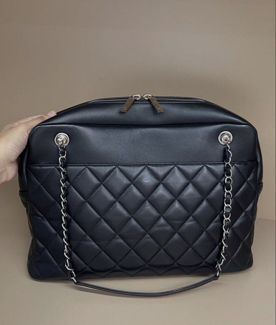 Chanel Black Quilted Leather Chain Shoulder Bag (Category: Luxury Bags & Wallets) located in Makati City. Submitted by dgcurated09 (Listing ID 1464308260, Image 2). Description: - 24xxxx series Classic black Chanel bag - Quilted leather with silver chain straps - Secure top zip closure - Spacious interior with multiple pockets for organization - Ideal for daily use or travel.