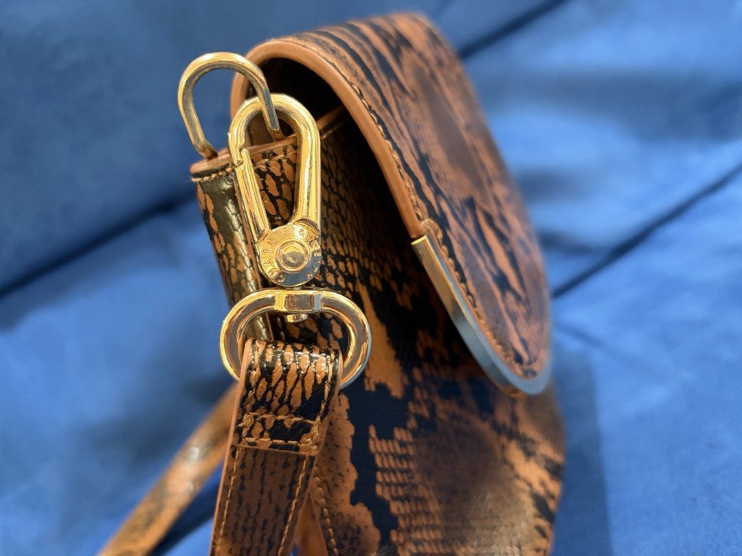 Charles and Keith snake skin pattern bag (Category: Cross-body Bags) located in Naga. Submitted by grand_trehh (Listing ID 1464171996, Image 3). Description: no issue like new .