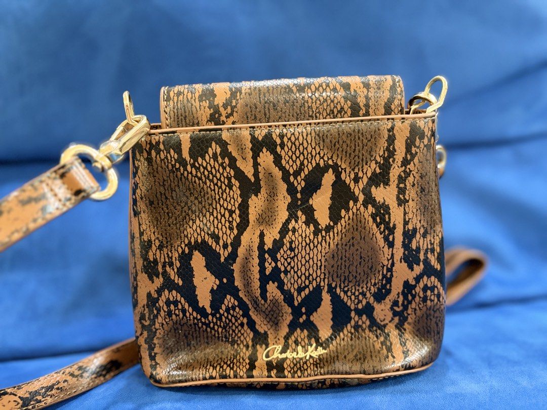 Charles and Keith snake skin pattern bag (Category: Cross-body Bags) located in Naga. Submitted by grand_trehh (Listing ID 1464171996, Image 2). Description: no issue like new .