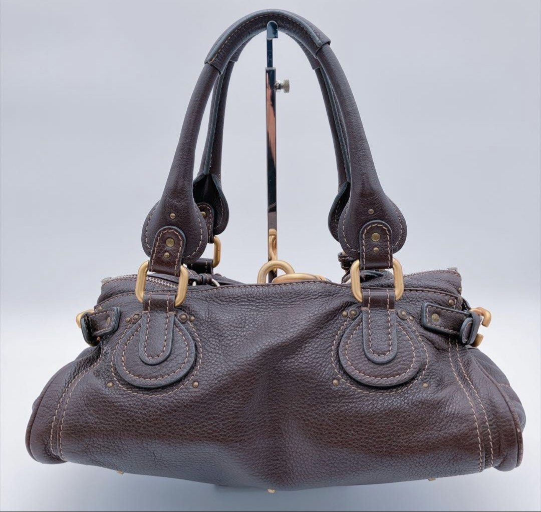 Chloe Medium Paddington Dark Brown (Category: Shoulder Bags) located in Las Pinas. Submitted by daisuki_japan_luxury_by_reiko (Listing ID 1464153384, Image 2). Description: ◆Product Name: 8AAM016 Chloe Paddington Handbag Dark Brown Chloe Bag - As-Is ◆Color: Dark Brown ◆Product Condition: Scuffs, dirt, and rust due to age. There are no major scratches or noticeable stains, but there are some minor scratches and dirt from normal use. It is still pe