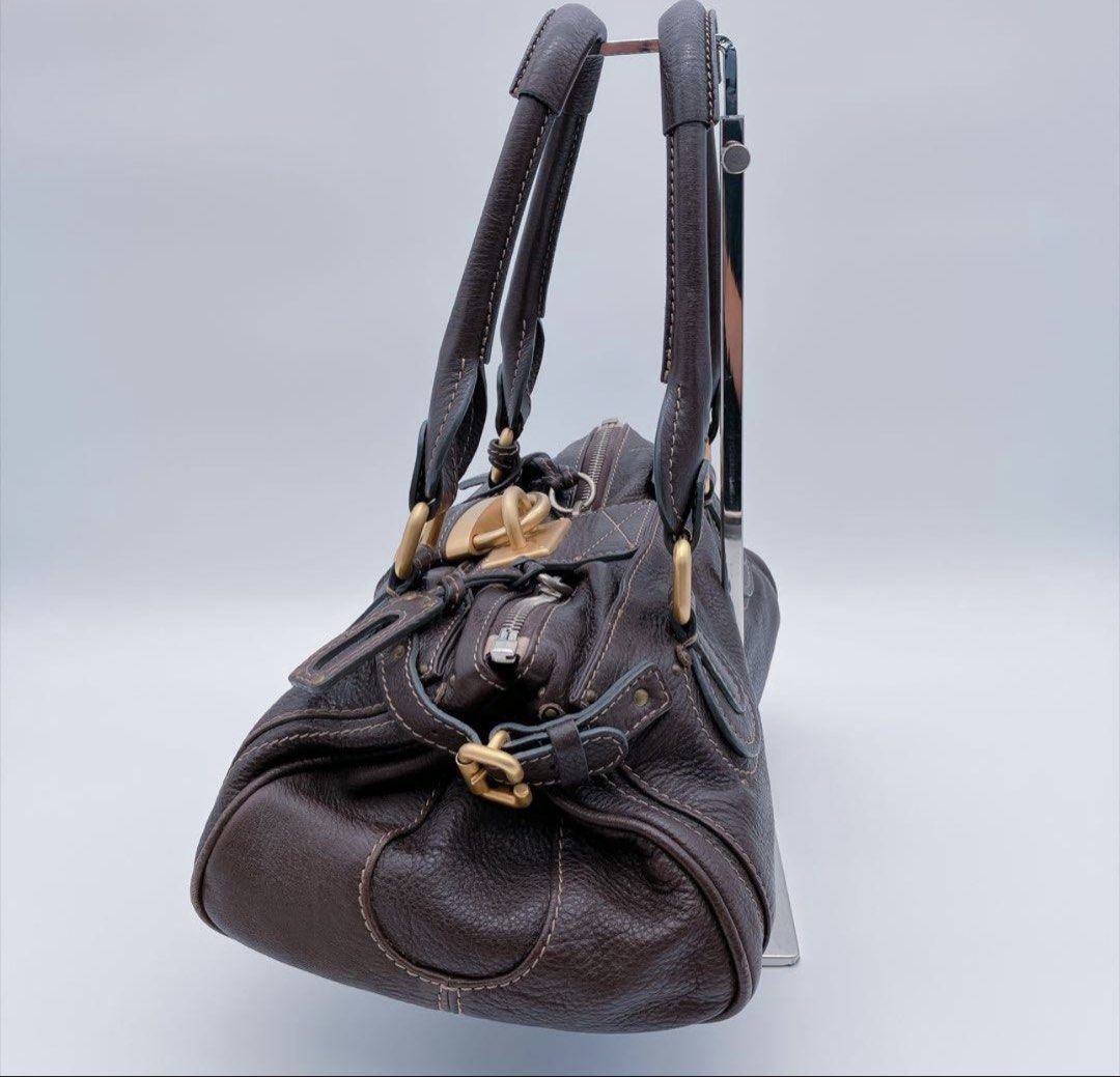 Chloe Medium Paddington Dark Brown (Category: Shoulder Bags) located in Las Pinas. Submitted by daisuki_japan_luxury_by_reiko (Listing ID 1464153384, Image 3). Description: ◆Product Name: 8AAM016 Chloe Paddington Handbag Dark Brown Chloe Bag - As-Is ◆Color: Dark Brown ◆Product Condition: Scuffs, dirt, and rust due to age. There are no major scratches or noticeable stains, but there are some minor scratches and dirt from normal use. It is still pe