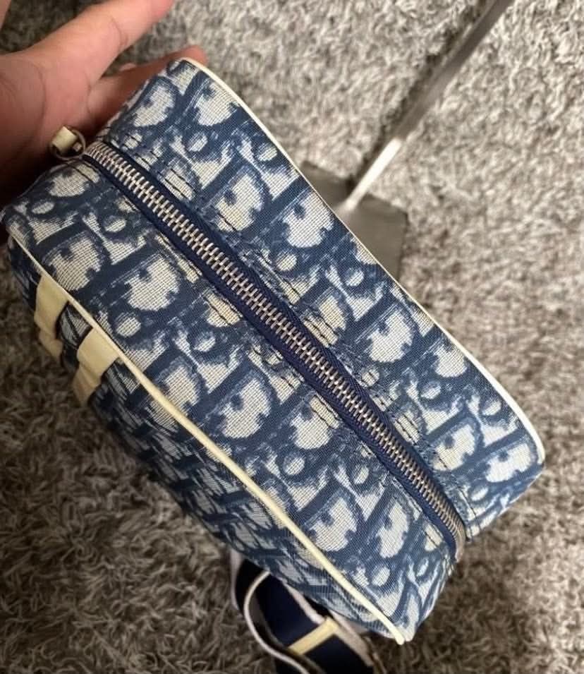 Christian Dior Monogram Trotter Shoulder Bag (Category: Luxury Bags & Wallets) located in Manila. Submitted by rufus_apparel (Listing ID 1464302581, Image 2). Description: - Authentic Dior Trotter shoulder bag - Classic blue and white monogram pattern - Iconic '2' graphic detail - Secure zip closure - Navy interior lining - Made in Italy - Comes with original dust bag.