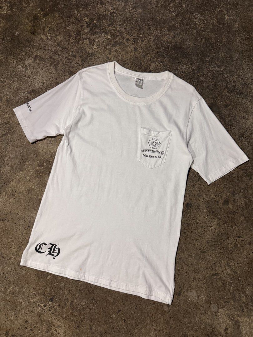 Chrome Hearts Los Angeles Pocket Tee (Category: Tshirts & Polo Shirts ) located in Pasig City. Submitted by dripthrift1600 (Listing ID 1464253628, Image 1). Description: - Authentic White Chrome Hearts T-Shirt - Size: XL - Iconic Chrome Hearts logo on chest pocket - Large Chrome Hearts graphic on the back - 'CH' logo detail on the sleeve - Made in USA - Dimes: 18x28.