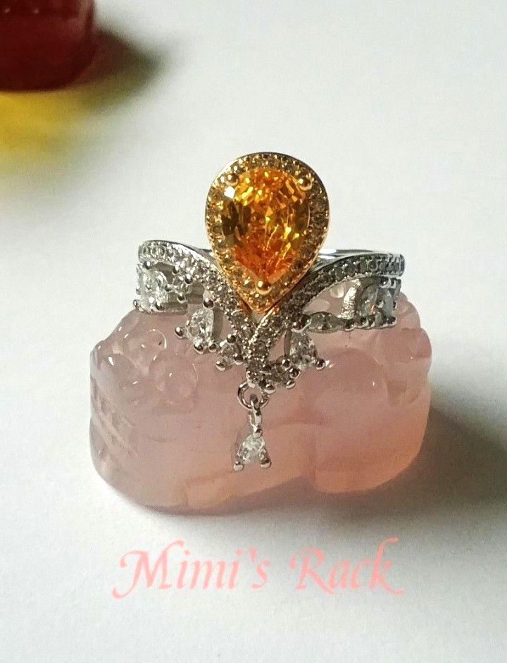 Citrine Pear Cut Adjustable Ring (Category: Rings) located in Taguig. Submitted by mimisrack (Listing ID 1464275378, Image 3). Description: 💛Add a touch of elegance with this stunning Citrine Pear Cut Adjustable Ring. Featuring a brilliant pear-shaped citrine centerpiece accented with sparkling clear stones and a delicate dangling crystal, this ring offers timeless beauty with a graceful, feminine design. ✨Citrine is known as the "Merchant's Sto