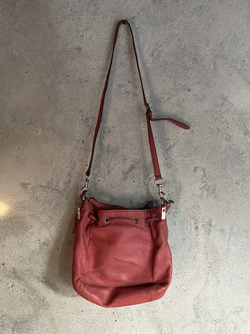 Coach Avery Peach 2 Way Bucket Bag (Category: Cross-body Bags) located in Adams. Submitted by princess.maggie (Listing ID 1464233355, Image 3). Description: Coach Avery Peach 2 Way Bucket Bag - authentic - needs cleaning only - has minor issue. see last pic - color peach.