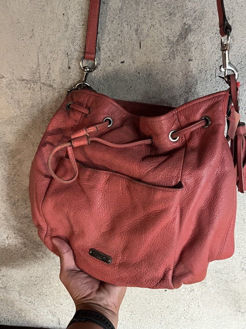 Coach Avery Peach 2 Way Bucket Bag (Category: Cross-body Bags) located in Adams. Submitted by princess.maggie (Listing ID 1464233355, Image 2). Description: Coach Avery Peach 2 Way Bucket Bag - authentic - needs cleaning only - has minor issue. see last pic - color peach.