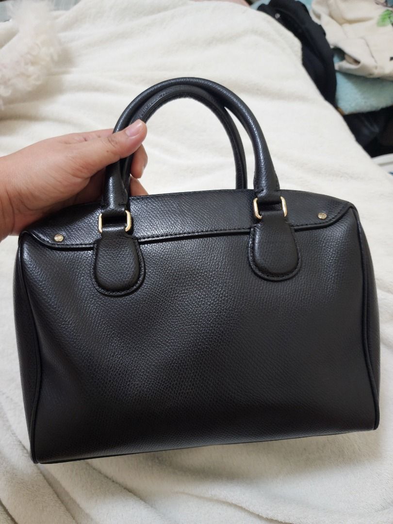 Coach Black Leather Satchel Bag with Strap (Category: Luxury Bags & Wallets) located in Caloocan City. Submitted by keenmoon.752ef0 (Listing ID 1464335823, Image 2). Description: - Authentic Coach black leather satchel bag - Versatile: Top handles and detachable crossbody strap - Elegant gold hardware details - Beautiful textured leather - Ample interior space for essentials - Ideal for everyday wear and evening outings.