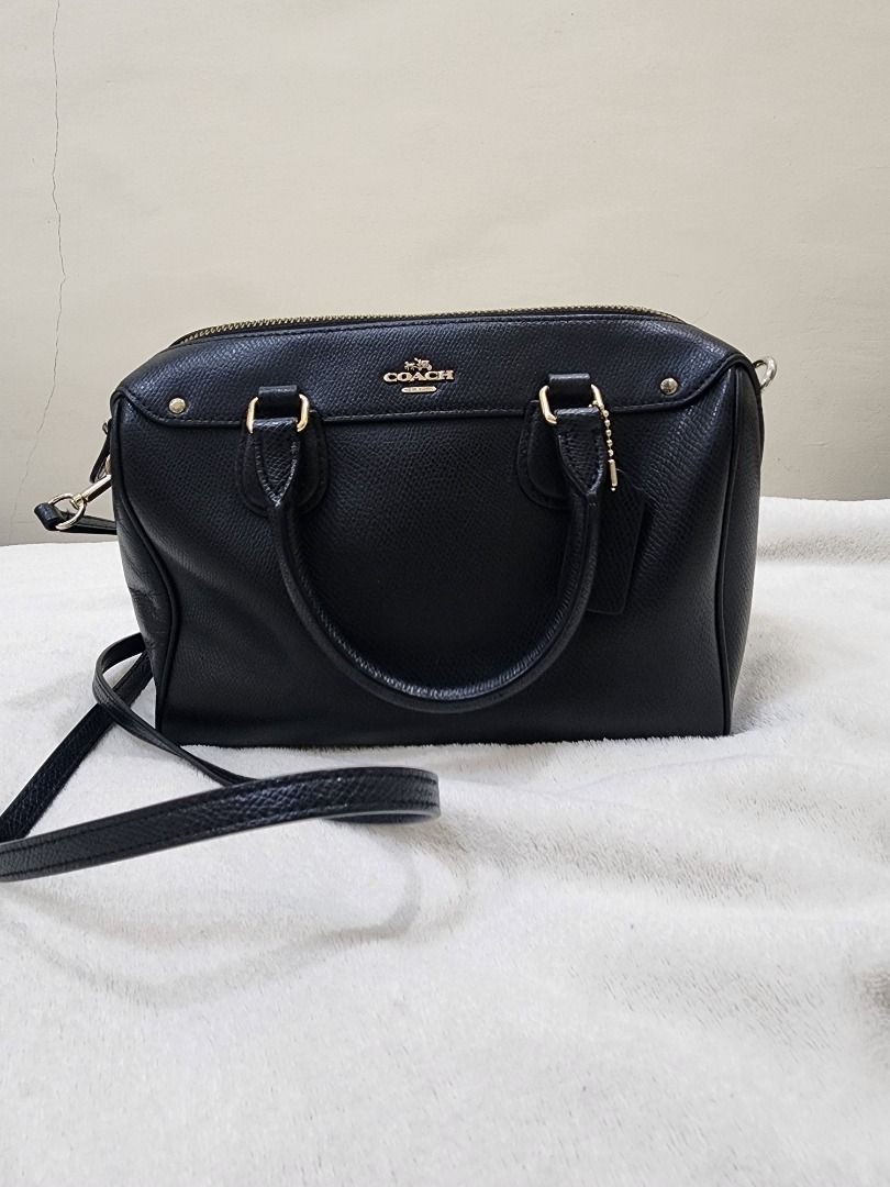 Coach Black Leather Satchel Bag with Strap (Category: Luxury Bags & Wallets) located in Caloocan City. Submitted by keenmoon.752ef0 (Listing ID 1464335823, Image 1). Description: - Authentic Coach black leather satchel bag - Versatile: Top handles and detachable crossbody strap - Elegant gold hardware details - Beautiful textured leather - Ample interior space for essentials - Ideal for everyday wear and evening outings.