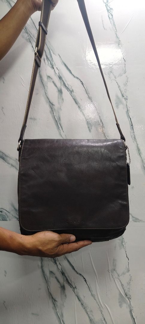 Coach Dark Brown Leather Messenger Bag (Category: Luxury Bags & Wallets) located in Caloocan City. Submitted by aliling30 (Listing ID 1464180806, Image 1). Description: - Coach messenger bag - Genuine dark brown leather - Spacious interior with multiple pockets - Adjustable strap for comfort - Ideal for daily use or travel - Shows some signs of wear, but in good overall condition.