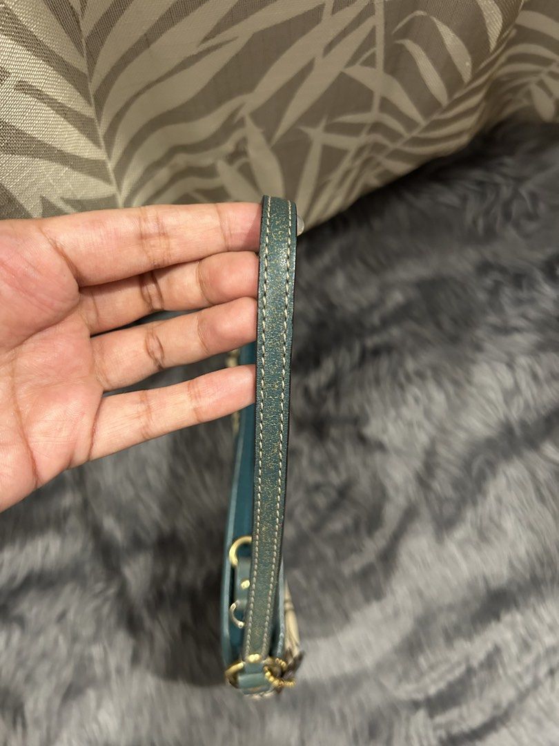 Coach Kili bag (Category: Luxury Bags & Wallets) located in Cabiao. Submitted by hoardercanthelpit (Listing ID 1464210695, Image 3). Description: - Authentic Coach wristlet - Classic monogram canvas with green leather trim - Unique textured green panel - Compact size, ideal for essentials - Detachable strap for versatility.