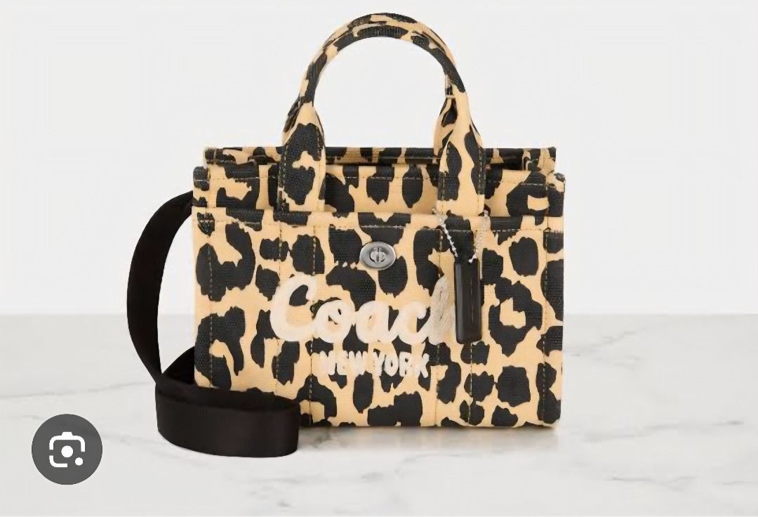 Coach Leopard Print Tote Bag With Strap (Category: Tote Bags) located in Manila. Submitted by katkween23 (Listing ID 1464225787, Image 2). Description: - Cute Coach tote bag - Fun all-over leopard print - Embroidered Coach New York logo on front - Top handles - Detachable crossbody strap - Small leather tag attached - Great for everyday use.