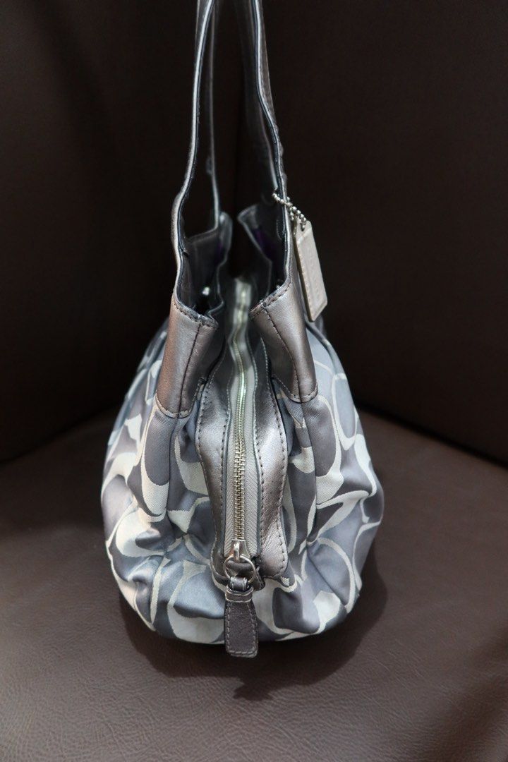 Coach Lexi Blue Silver (Category: Shoulder Bags) located in Manila. Submitted by dragonflyvintage_ (Listing ID 1464189419, Image 3). Description: 𝐂𝐂𝐇 𝐋𝐄𝐗𝐈 𝐒𝐈𝐋𝐕𝐄𝐑 𝐁𝐋𝐔𝐄 Silver Blue Canvas + Metallic Leather 👜 TO CLAIM: Comment MINE or RESERVE. * MINE — ₱3,999 *full payment in 24hrs * RESERVE — ₱4,099 *₱500 deposit + balance within 3 days ☑️ CONDITION B — Good Vintage Condition * few stains & scratches * minimal interior signs of u