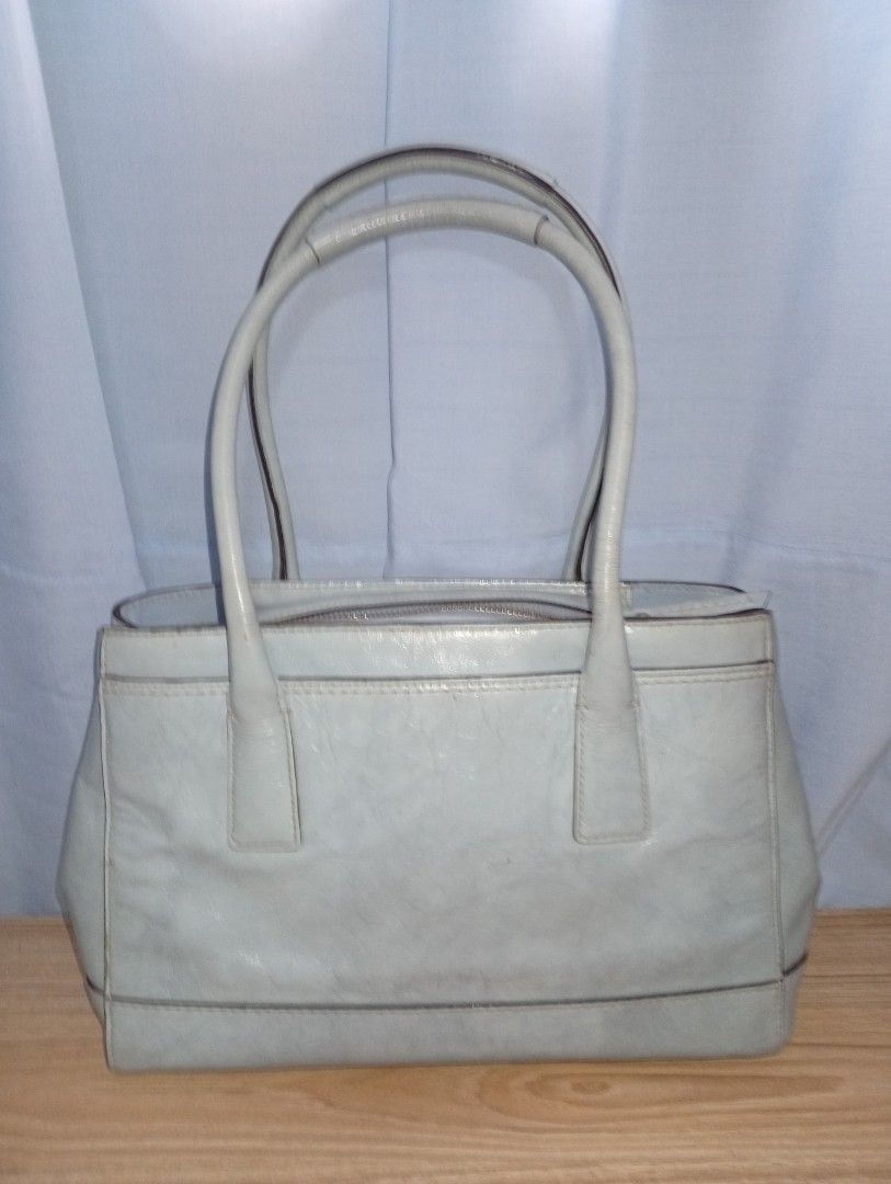 Coach Light Blue Leather Tote Bag (Category: Luxury Bags & Wallets) located in Malabon City. Submitted by momshieraqz (Listing ID 1464268638, Image 2). Description: Authentic Coach Leather Handbag – Creed L0793-11788👜 Description: Authentic Coach calf leather handbag, purchased abroad. Creed number: L0793-11788 (proof of authenticity) Material: Finest calf leatherColor: Light blue with gold hardware Condition: Pre-loved, with minor creases and l