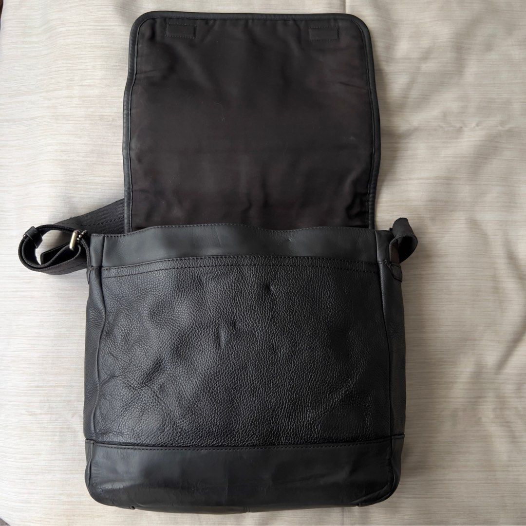 Coach Men’s Camden Leather Messenger Bag (Category: Luxury Bags & Wallets) located in Pasig City. Submitted by jenscloset86 (Listing ID 1464298568, Image 2). Description: COACH Men’s Camden Leather Crossbody Bag • Pebbled cowhide leather • No inclusion. • With visible wear and tear (see photos for reference) • A part of the fabric strap is fraying and has some discoloration. • Leather cracking at the bottom part (front) and in 1 anchor holding th