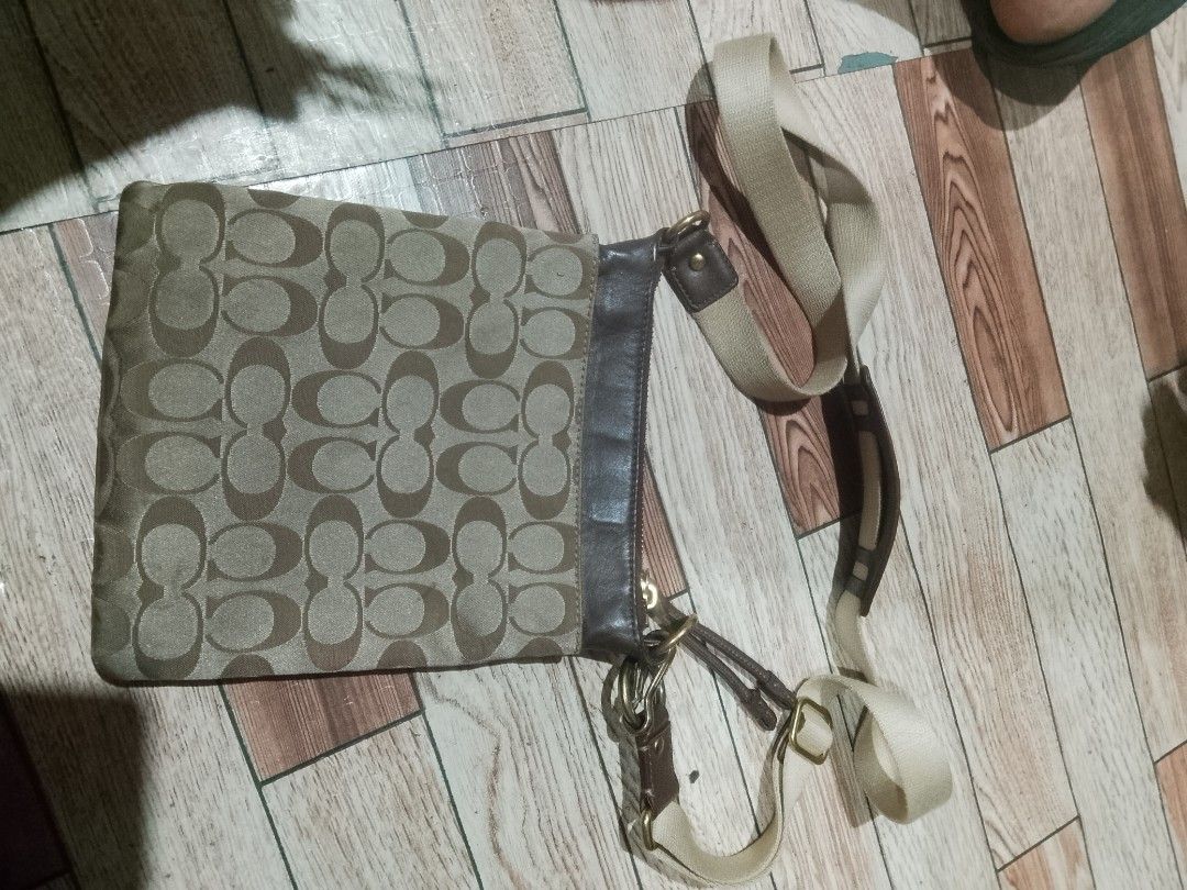 Coach Monogram Canvas & Leather Crossbody Bag (Category: Luxury Bags & Wallets) located in Quezon City. Submitted by theoneshop1 (Listing ID 1464269900, Image 2). Description: - Authentic Coach crossbody bag - Signature monogram canvas with brown leather trim - Adjustable strap for comfortable wear - Elegant gold hardware details - Spacious interior for everyday essentials - Versatile for daily use.