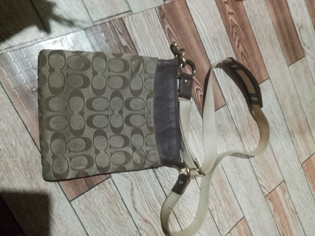 Coach Monogram Canvas & Leather Crossbody Bag (Category: Luxury Bags & Wallets) located in Quezon City. Submitted by theoneshop1 (Listing ID 1464269900, Image 1). Description: - Authentic Coach crossbody bag - Signature monogram canvas with brown leather trim - Adjustable strap for comfortable wear - Elegant gold hardware details - Spacious interior for everyday essentials - Versatile for daily use.