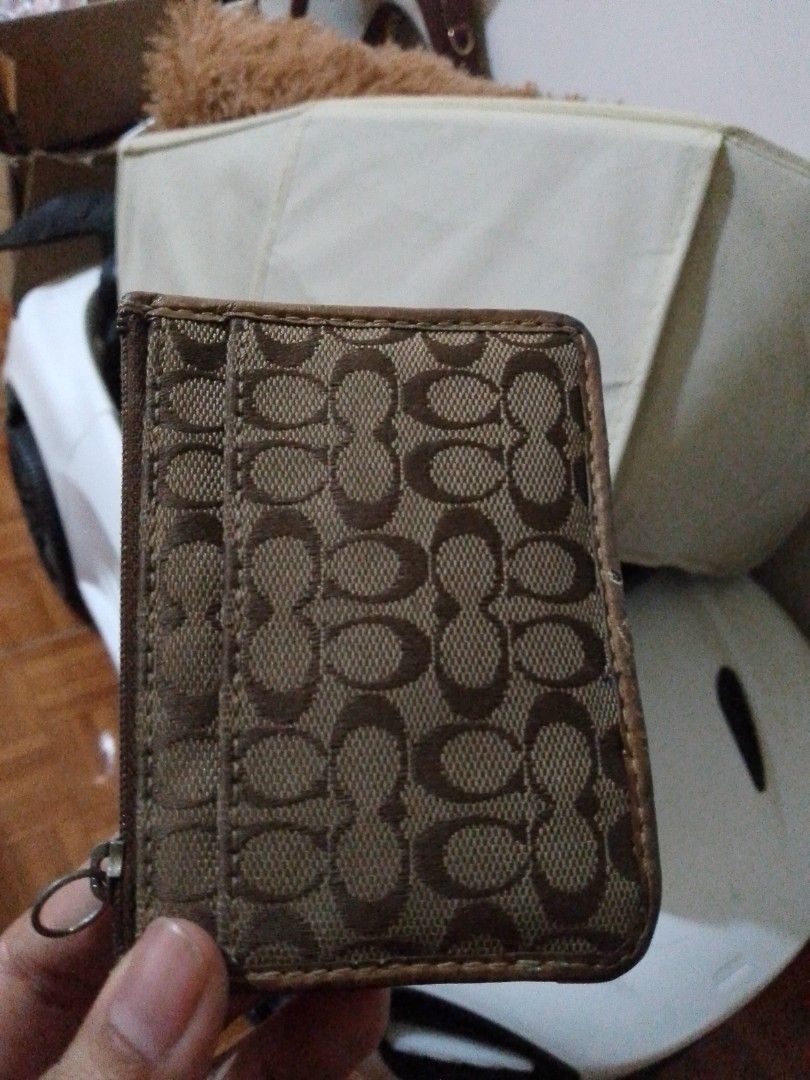 Coach Monogram Canvas Card Holder with Zipper (Category: Luxury Bags & Wallets) located in Manila. Submitted by russelsimo37305 (Listing ID 1464240245, Image 1). Description: - Authentic Coach card holder - Classic monogram pattern - Zippered compartment for coins/cash - Multiple card slots - Genuine leather trim - Perfect for everyday essentials.