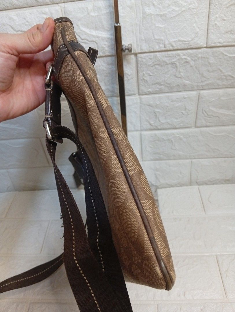 Coach Monogram Canvas Crossbody Bag (Category: Luxury Bags & Wallets) located in Las Pinas. Submitted by etoksi1234 (Listing ID 1464197631, Image 3). Description: Pre-loved Coach Signature Monogram PVC Crossbody Bag with brown and beige, a dark vertical center stripe and "COACH EST. 1941" branding, resembling style model. (Issue- piping)..