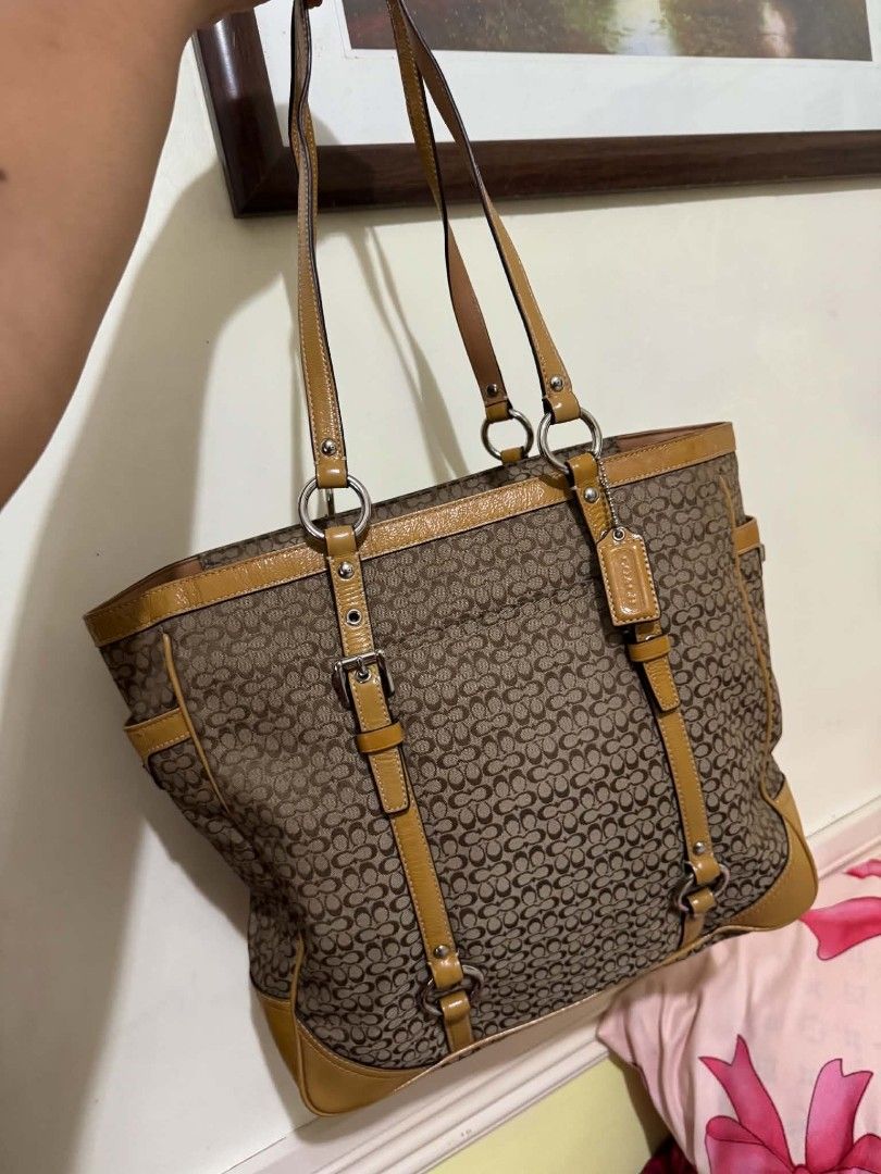 Coach Monogram Canvas Leather Trim Tote Bag (Category: Luxury Bags & Wallets) located in Manila. Submitted by shy177 (Listing ID 1464180282, Image 1). Description: - Classic Coach tote bag - Brown monogram canvas with tan leather trim and straps - Spacious interior with zip pocket - Two convenient side pockets - Ideal for everyday use.
