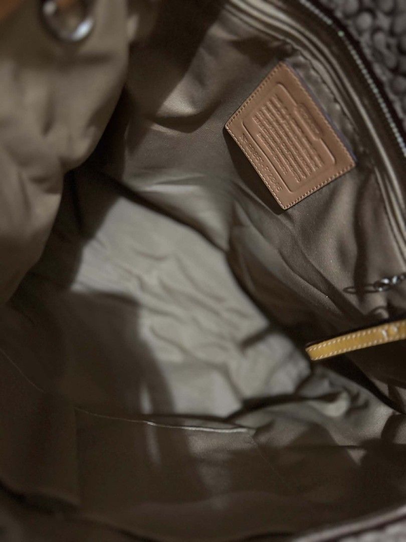 Coach Monogram Canvas Leather Trim Tote Bag (Category: Luxury Bags & Wallets) located in Manila. Submitted by shy177 (Listing ID 1464180282, Image 3). Description: - Classic Coach tote bag - Brown monogram canvas with tan leather trim and straps - Spacious interior with zip pocket - Two convenient side pockets - Ideal for everyday use.