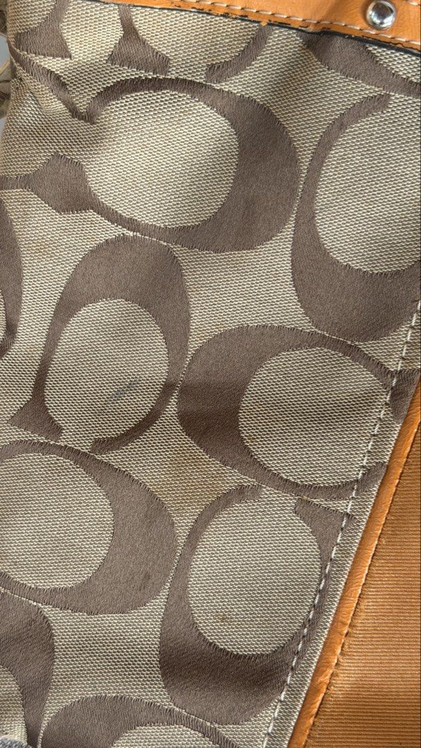 Coach Monogram Canvas Leather Trim Tote Bag (Category: Luxury Bags & Wallets) located in Batangas. Submitted by prelove.kk (Listing ID 1464219640, Image 2). Description: - Coach monogram canvas tote bag - Tan leather trim and handles - Zipper closure - Interior zippered and slip pockets - Minor marks on canvas - Wear on leather handles - Great everyday bag.