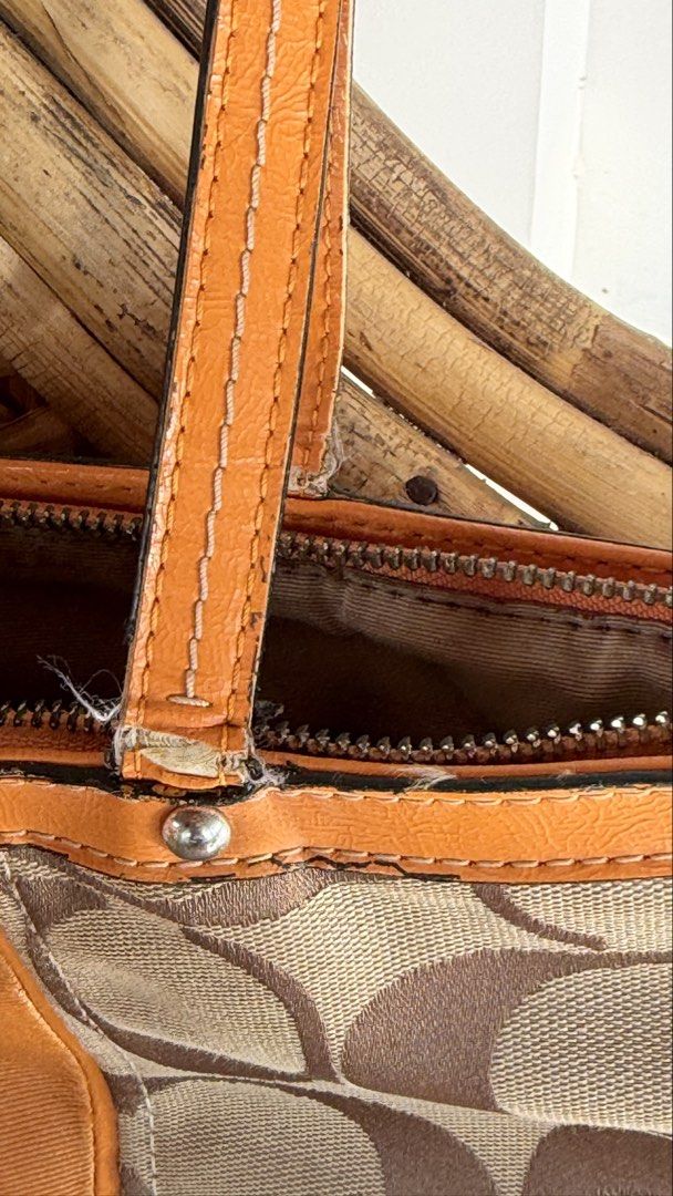 Coach Monogram Canvas Leather Trim Tote Bag (Category: Luxury Bags & Wallets) located in Batangas. Submitted by prelove.kk (Listing ID 1464219640, Image 3). Description: - Coach monogram canvas tote bag - Tan leather trim and handles - Zipper closure - Interior zippered and slip pockets - Minor marks on canvas - Wear on leather handles - Great everyday bag.