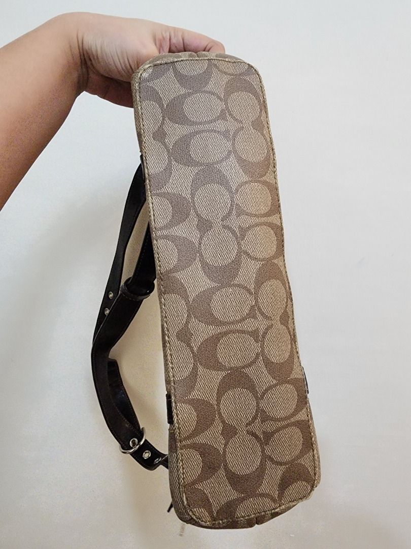 Coach Monogram Shoulder Bag (Category: Luxury Bags & Wallets) located in Caloocan City. Submitted by keenmoon.752ef0 (Listing ID 1464336095, Image 2). Description: - Authentic Coach shoulder bag - Classic brown monogram canvas - Black leather trim - Secure zipper closure - Interior zip and slip pockets - Perfect for everyday use.