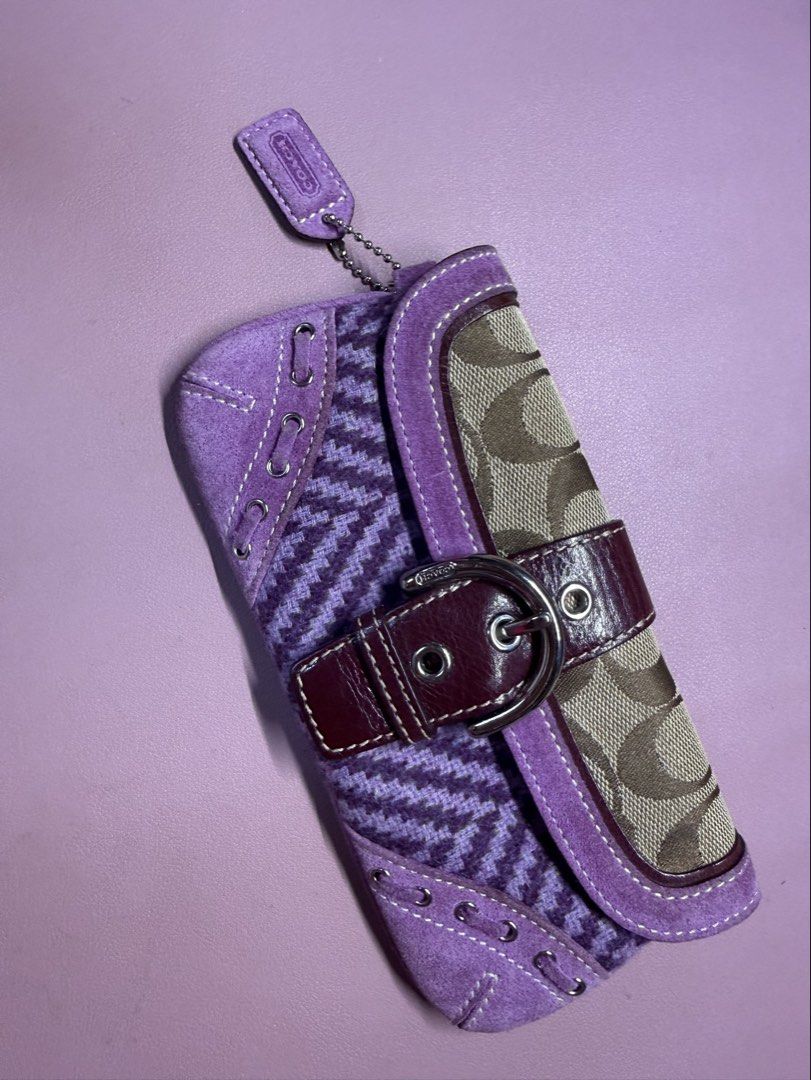 Coach Purple Herringbone Wristlet Wallet (send offer) (Category: Purses & Pouches) located in General Mariano Alvarez. Submitted by naoribear (Listing ID 1464315532, Image 1). Description: Send offers please Price based on listings online (open to offers) Only missing the lanyard - Adorable purple tweed Coach pouch - Elegant suede trim - Classic Coach monogram pattern on the flap - Secure buckle closure with a charming bow detail - Ideal size for