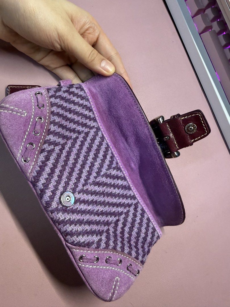 Coach Purple Herringbone Wristlet Wallet (send offer) (Category: Purses & Pouches) located in General Mariano Alvarez. Submitted by naoribear (Listing ID 1464315532, Image 3). Description: Send offers please Price based on listings online (open to offers) Only missing the lanyard - Adorable purple tweed Coach pouch - Elegant suede trim - Classic Coach monogram pattern on the flap - Secure buckle closure with a charming bow detail - Ideal size for