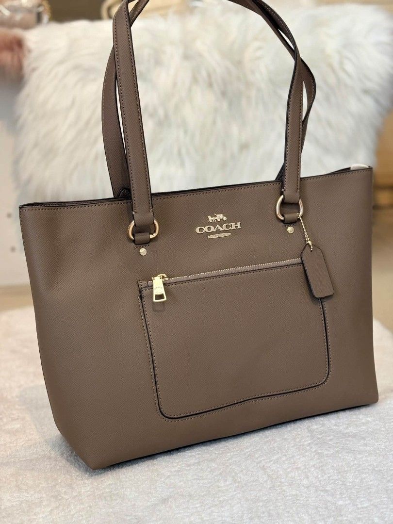 Coach Station Tote in Taupe (Category: Tote Bags) located in Quezon City. Submitted by bagsboutiqueph (Listing ID 1464189943, Image 1). Description: LAST PRICE POSTED. LIMITED STOCKS! BRANDNEW WITH INCLUSIONS. COLOR MAY SLIGHTLY VARY IN ACTUAL DUE TO LIGHTING AND CAMERA SETTING. OTHER PHOTOS WILL BE SEND DURING PURCHASE AND FOR SURE BUYERS ONLY. WHEN IN DOUBT, DO NOT ORDER. THANK YOU..