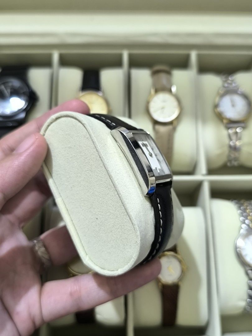 COACH Swiss Made Vintage Watch (Category: Women's Watches) located in Pasig City. Submitted by thevintagechroniclefindsph (Listing ID 1464211627, Image 3). Description: Classic rectangular/tank-style Coach dress watch with black leather strap. Silver/white dial with Arabic numerals and date display at 6 o'clock. WATCH DETAILS: Brand: COACH Ref./Model: 7.142.232 Swiss Made Quartz movement Stainless steel case Rectangular case Date display Black le
