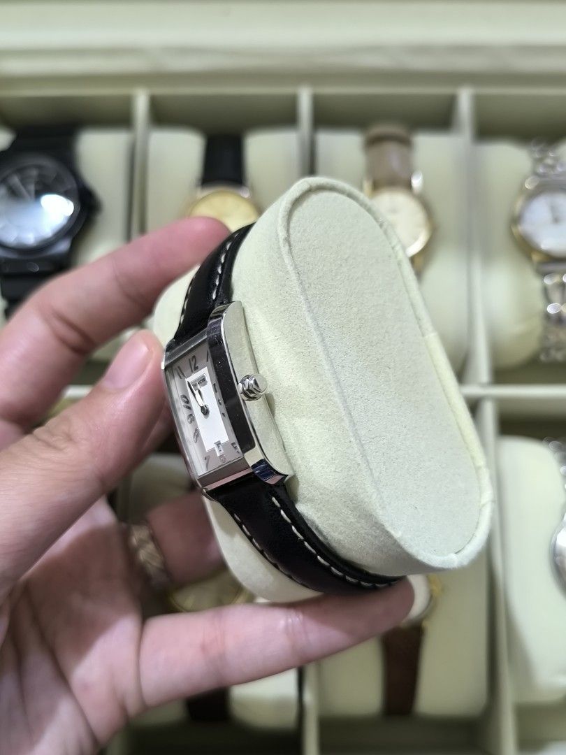 COACH Swiss Made Vintage Watch (Category: Women's Watches) located in Pasig City. Submitted by thevintagechroniclefindsph (Listing ID 1464211627, Image 2). Description: Classic rectangular/tank-style Coach dress watch with black leather strap. Silver/white dial with Arabic numerals and date display at 6 o'clock. WATCH DETAILS: Brand: COACH Ref./Model: 7.142.232 Swiss Made Quartz movement Stainless steel case Rectangular case Date display Black le